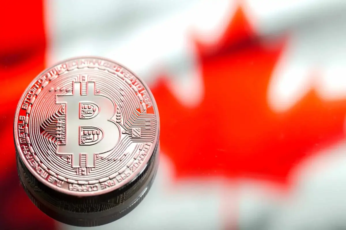 coins-bitcoin-against-the-background-of-canada-fla-C4QBC9R-1-scaled-ezgif.com-webp-to-jpg-converter